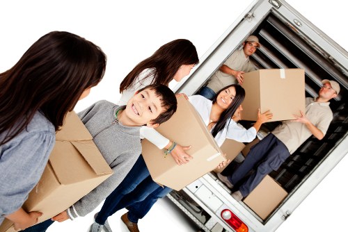 Man and van service team loading boxes and furniture for a customer booking