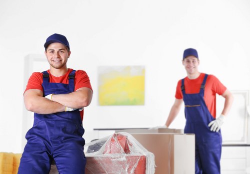 Commercial movers carrying office furniture in Soho