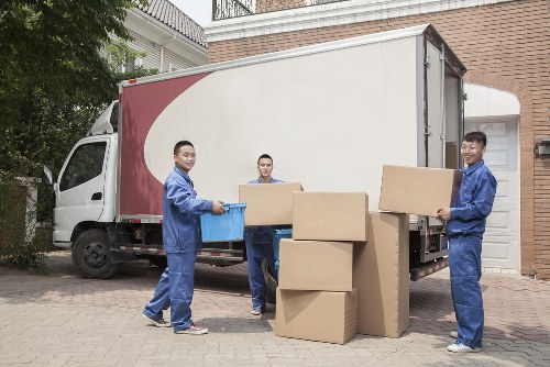 Soho moving van near busy city buildings and narrow streets