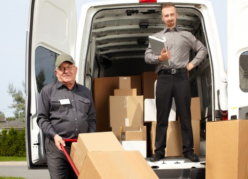 Movers handling a local relocation in Soho's busy central London streets