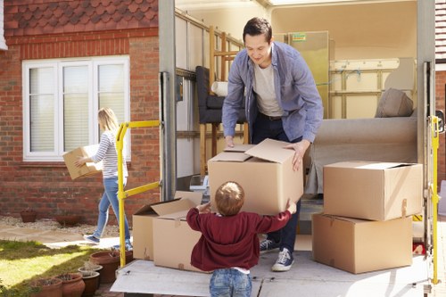 Professional movers carrying items in central London