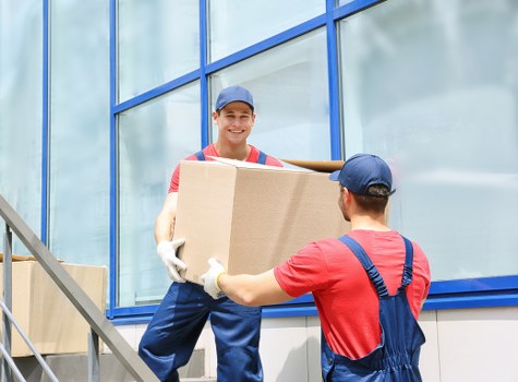 Students packing boxes for a move in Soho