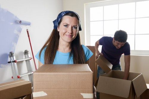 Worker assessing loading area risks during a house move