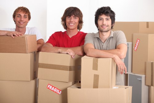 Loading boxes and furniture into a removal truck in Soho