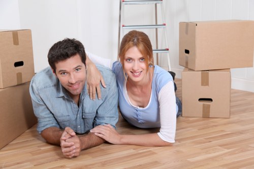 Removal team handling furniture in a Soho apartment building