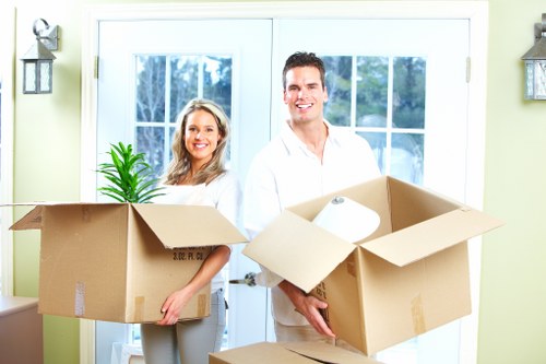 Moving van and removal team loading belongings during a central London Soho flat removal